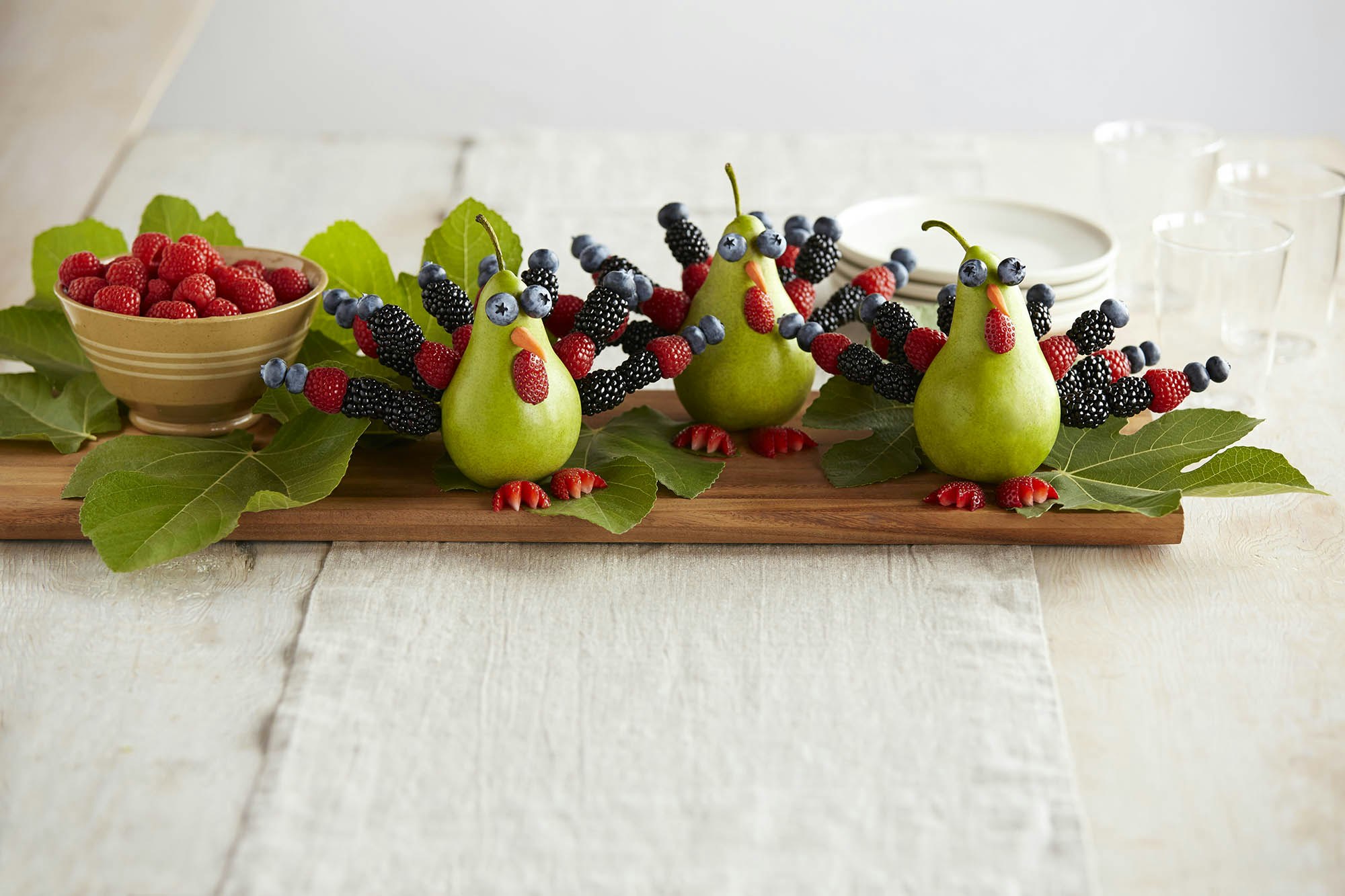 Turkeys made out of pears and berries