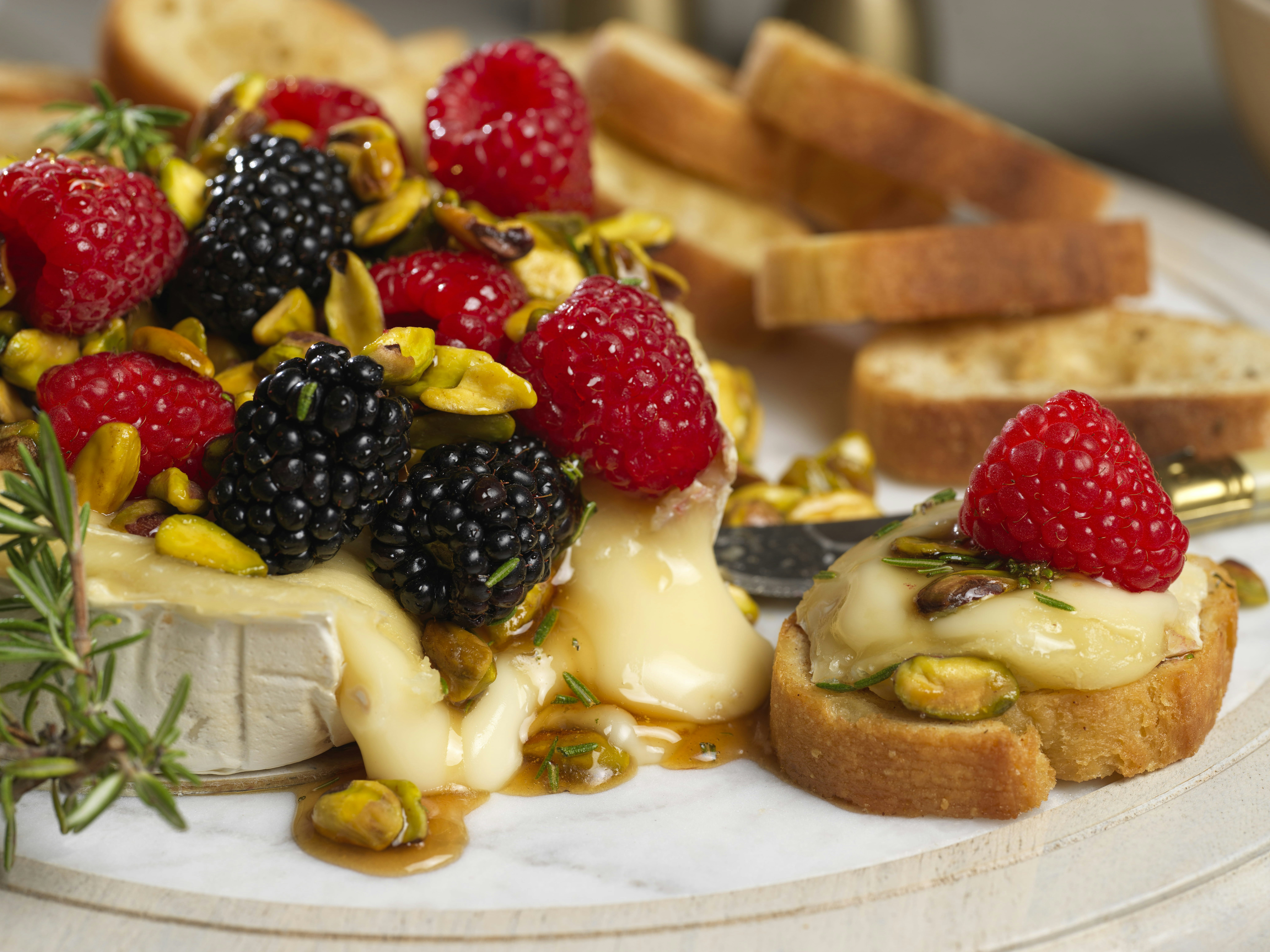 Baked brie with honeyed raspberries and pistachios