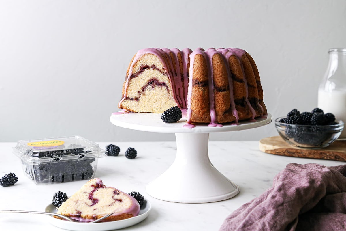 Vanilla bundt cake with blackberry swirls and vanilla glaze