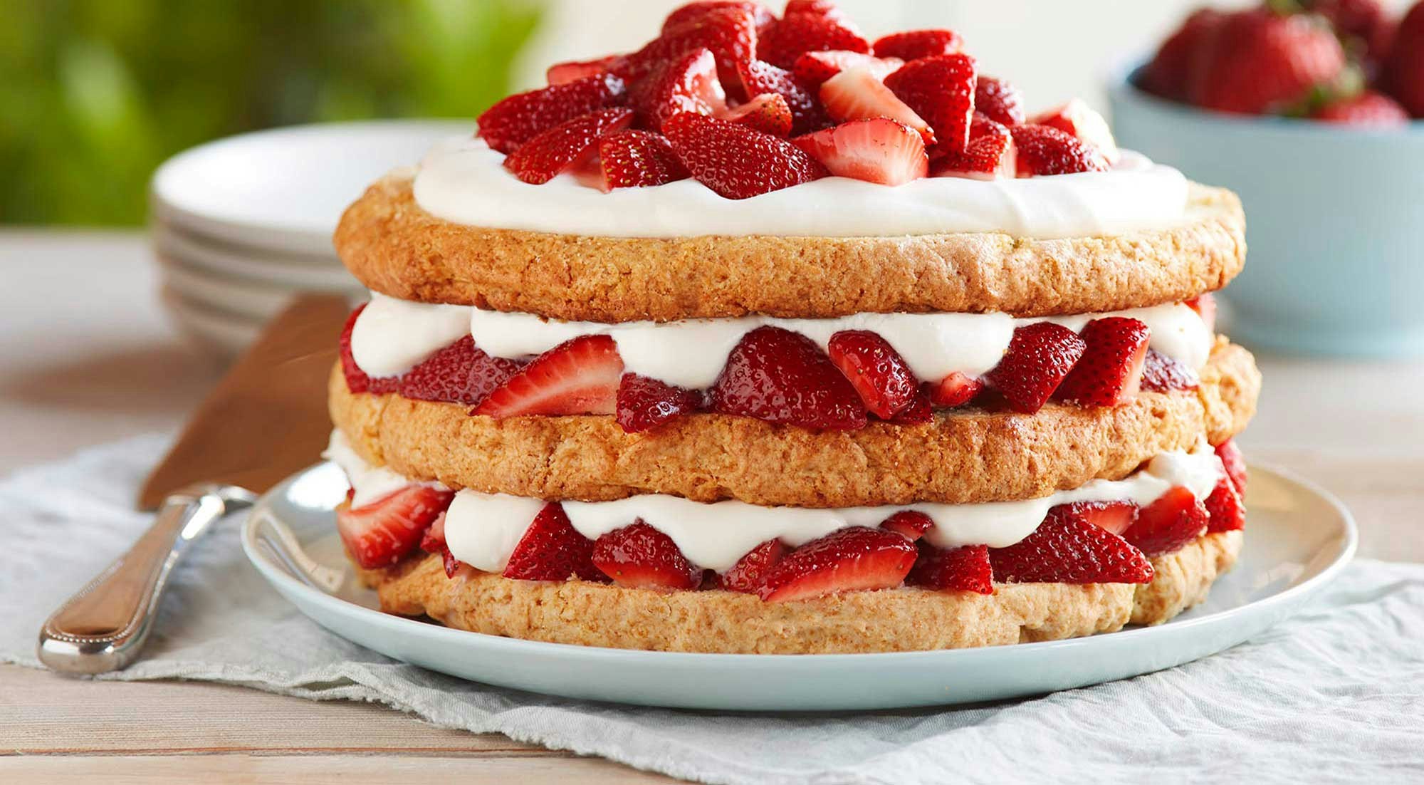Strawberry shortcake piled with strawberries
