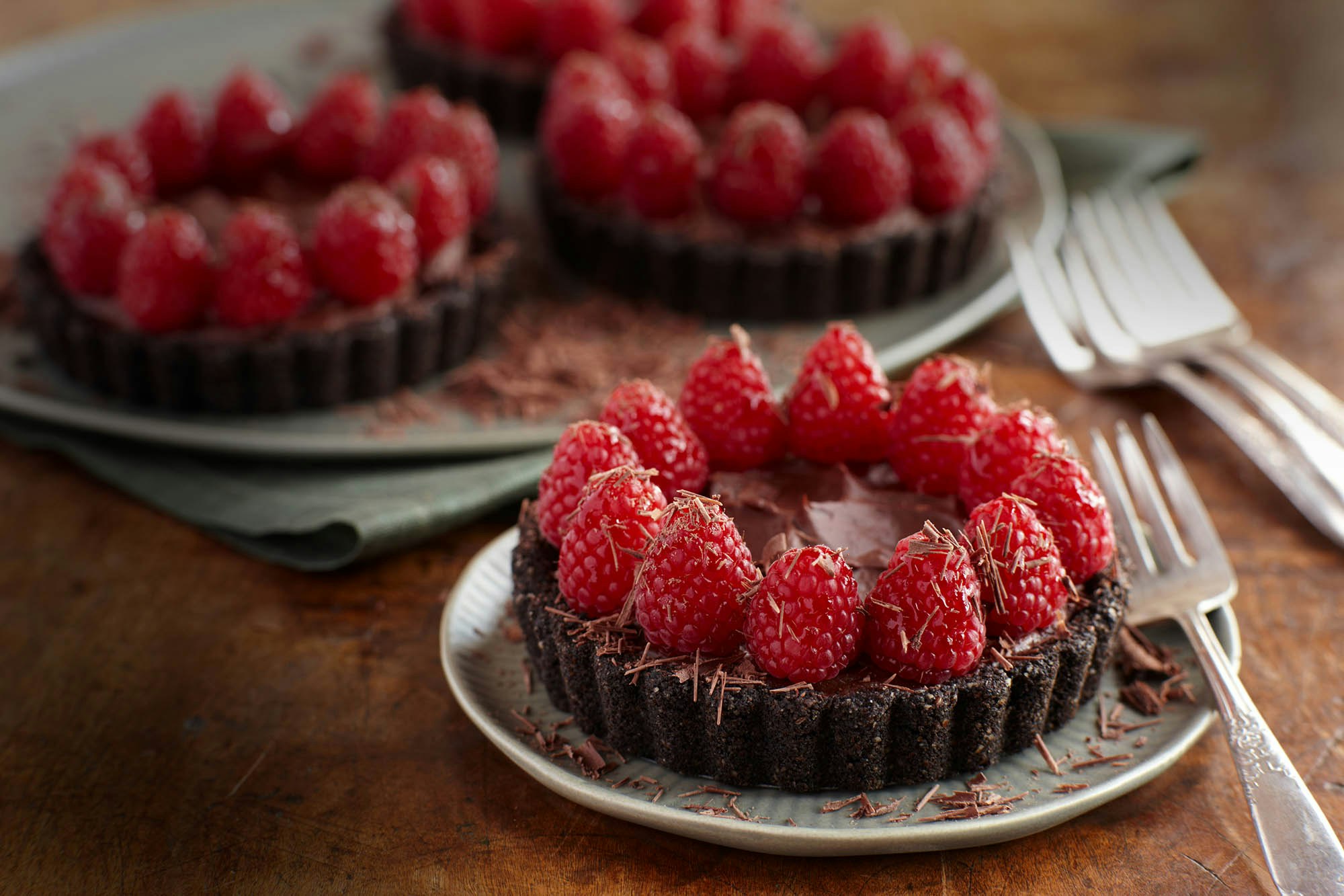 Double chocolate mousse tartlets with raspberries