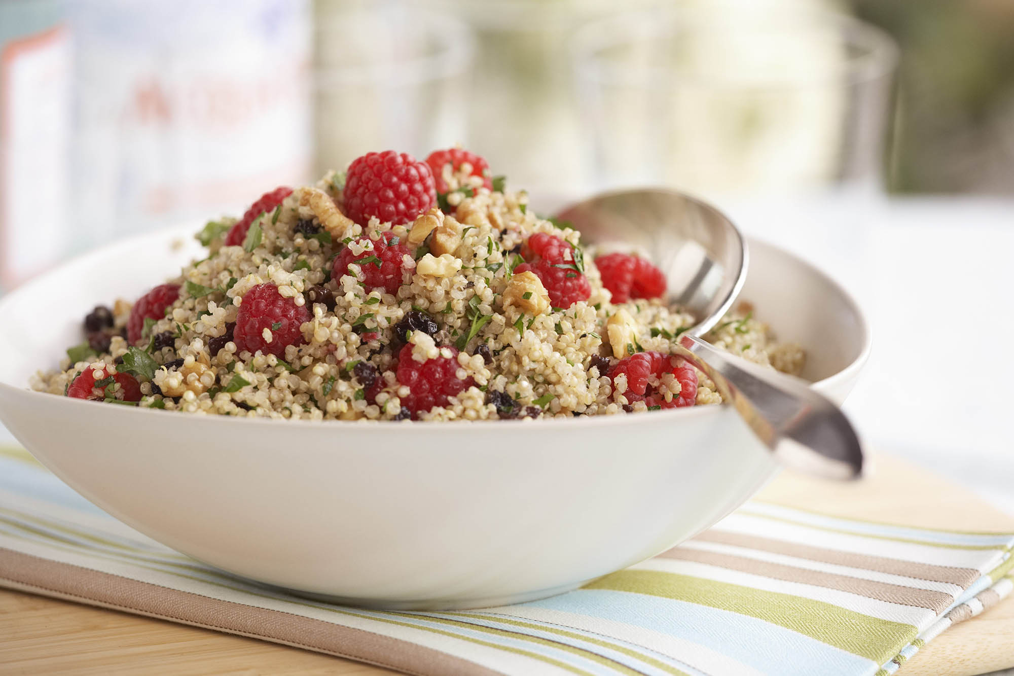 Bowl of quinoa pilaf with raspberries