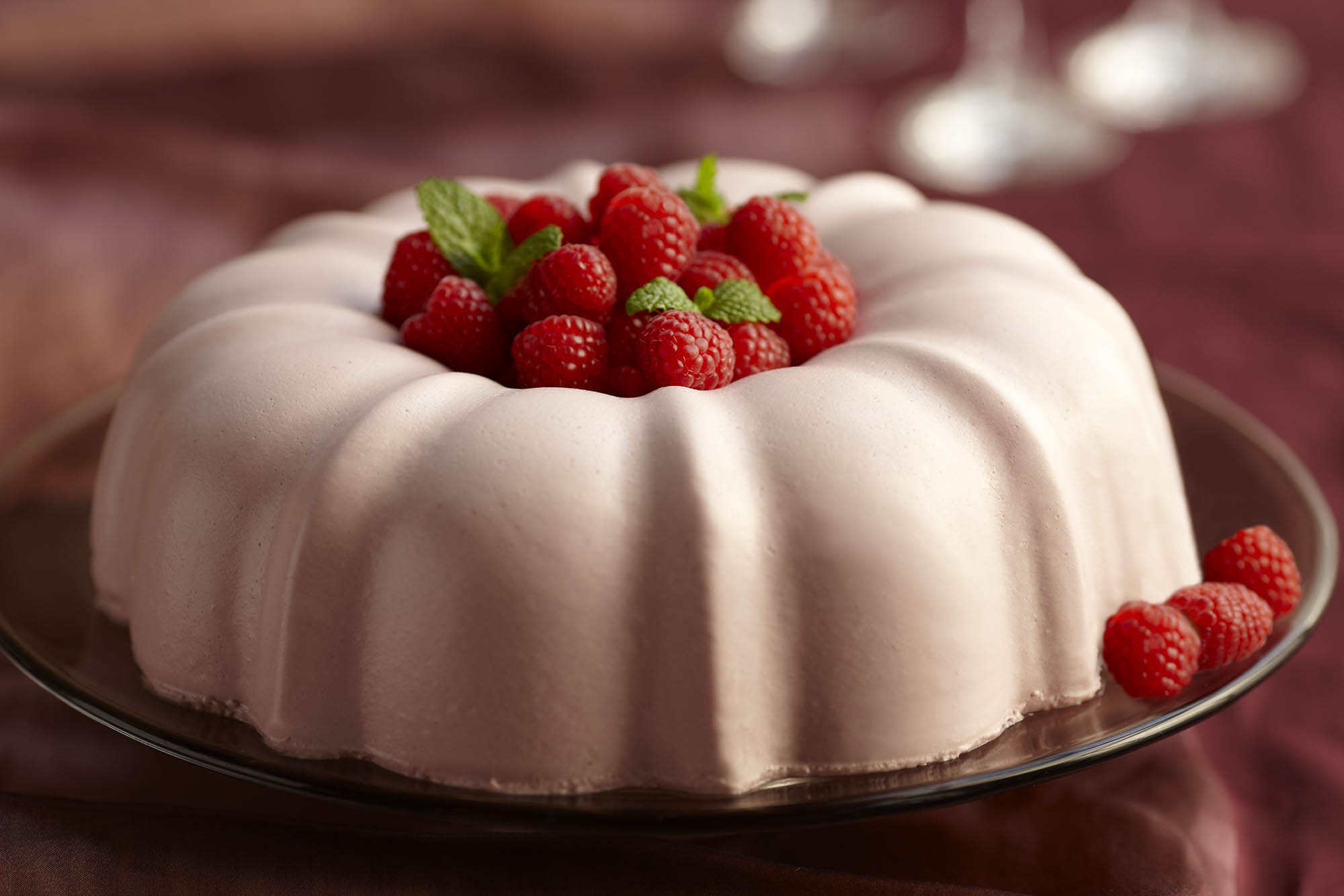 Raspberry champagne cassis mouse topped with raspberries