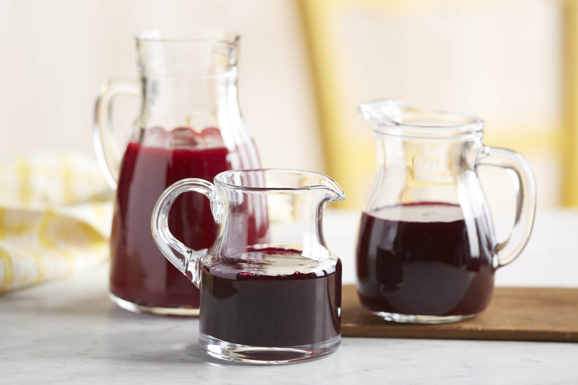 Three jars of raspberry syrup