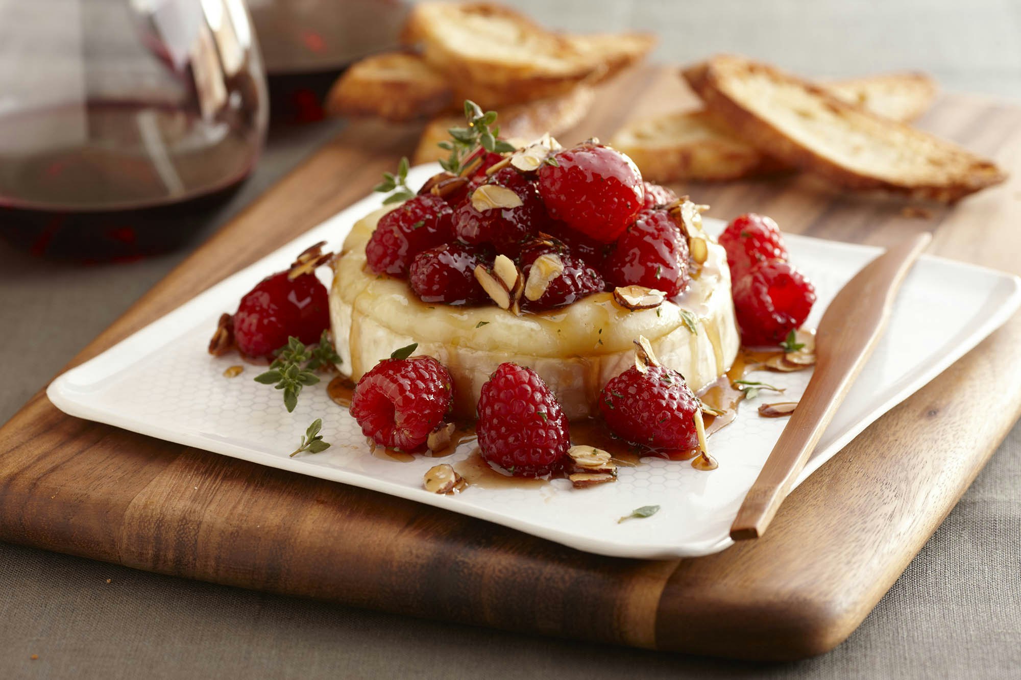 Warm brie with honeyed raspberries and almonds 