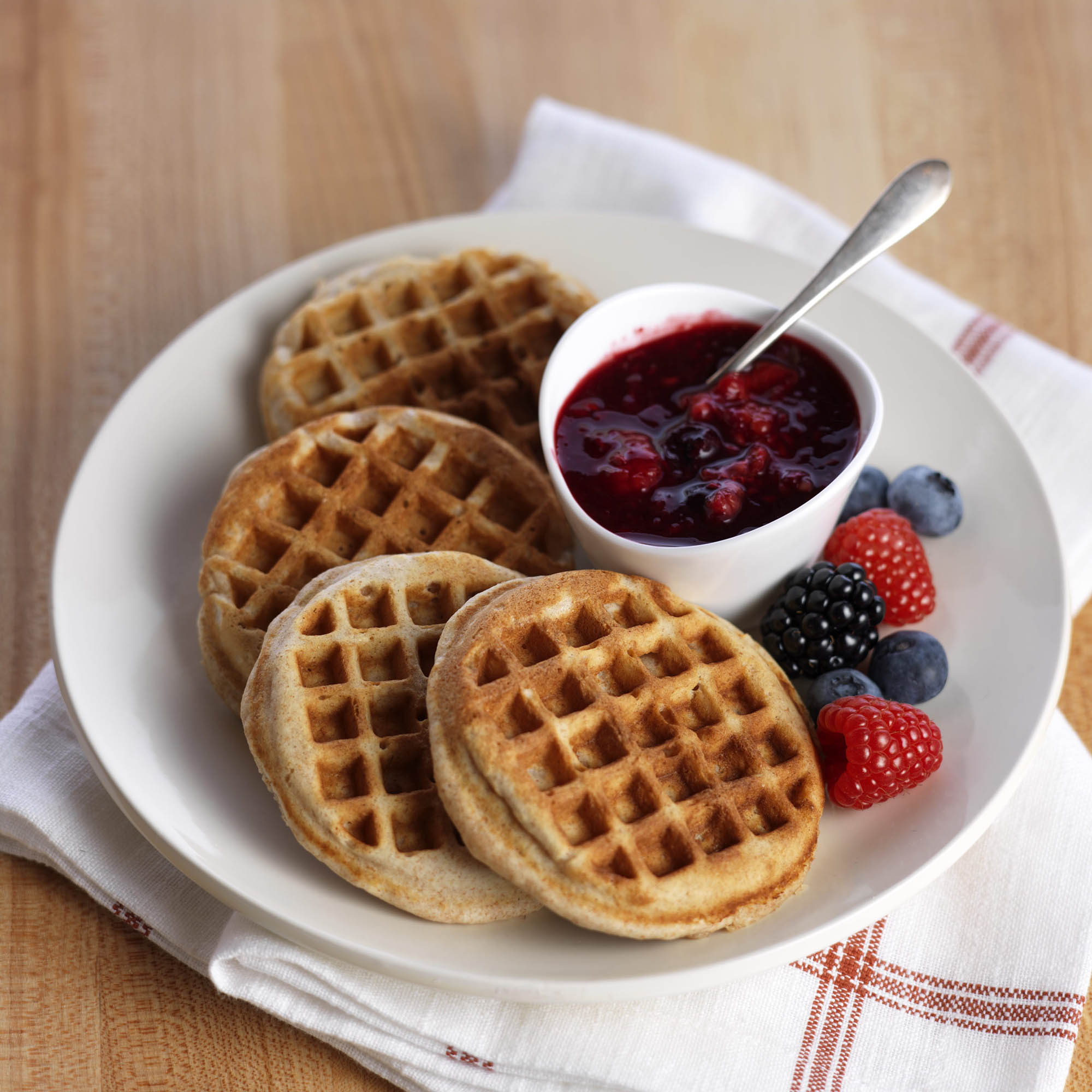 https://driscolls.imgix.net/-/media/assets/recipes/whole-wheat-almond-waffles-with-mixed-berry-sauce.ashx